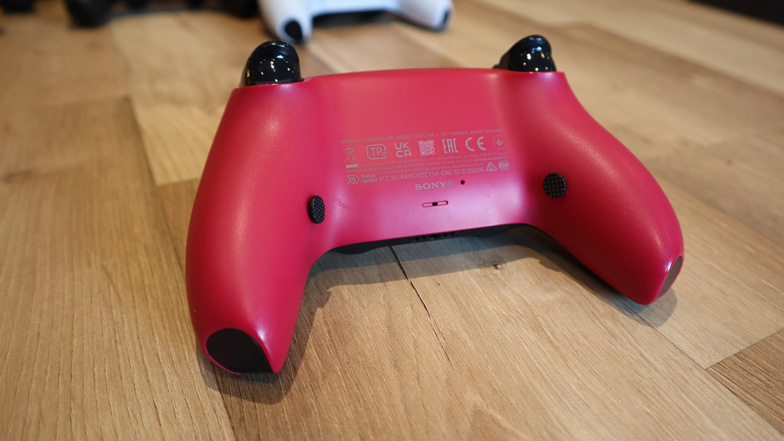 Close-up of rear macro buttons and wiring on a custom mod
